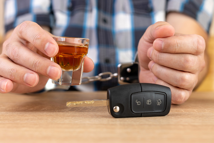 dui1.jpeg guys handcuffed while holding a shot