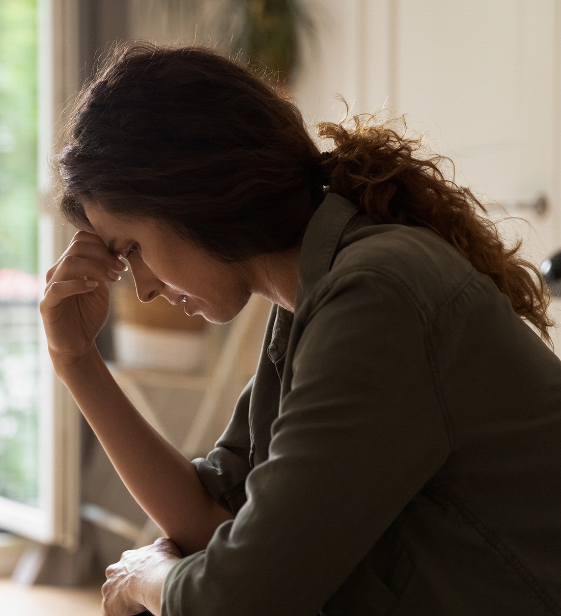 person with their hand of face