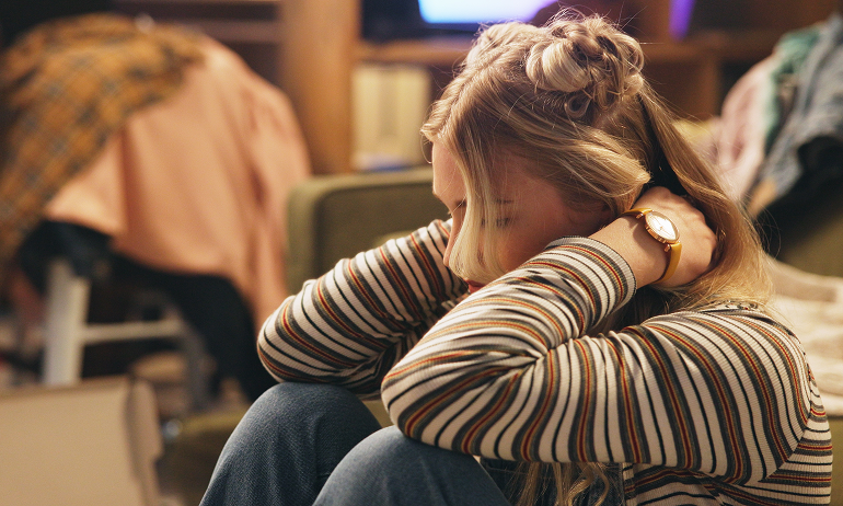 girl with hands behind her head